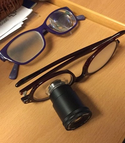 glasses that susana is using for reading