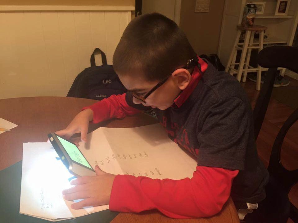 handheld video magnifier zoomax m5 was tested by leo, son of erin botelho, zoomax activity winner