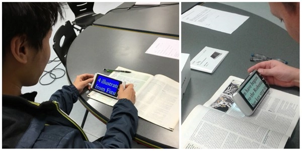 students from université de rouen demonstrating high contrast color modes of hand held video magnifier m5
