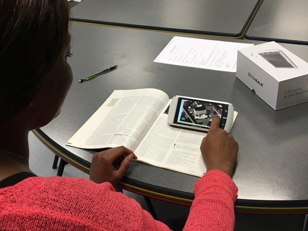 université de rouen students using hand held video magnifier m5 to read