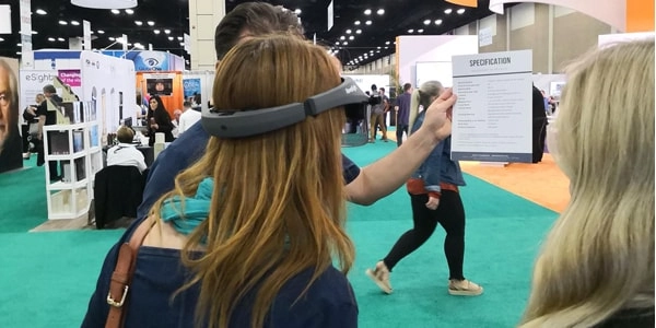 visitors trying revosight to see small print at a distance