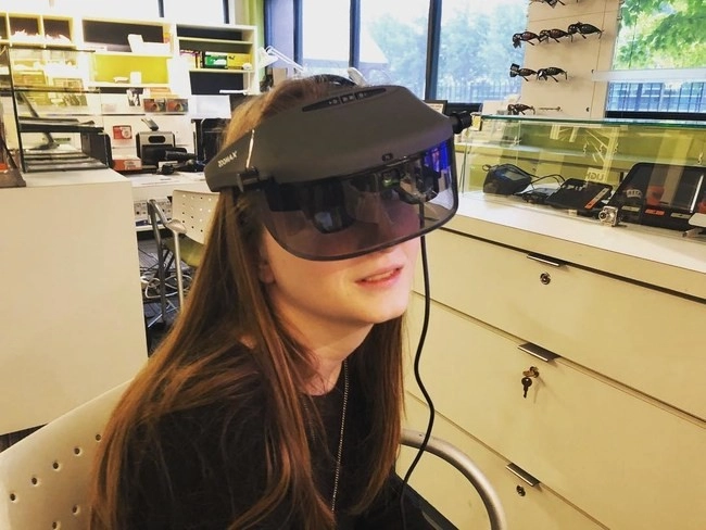 hayley trying electronic glasses acesight at the chicago lighthouse in illinois