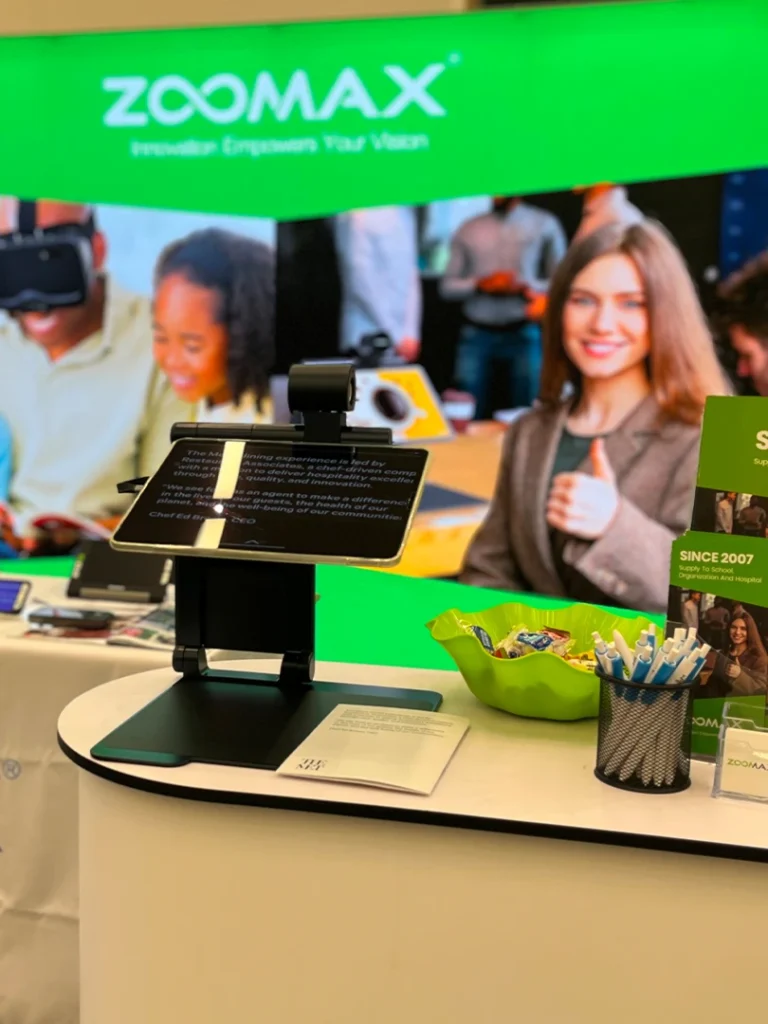 zoomax team demoing low vision magnifiers at sightcity frankfurt booth 1