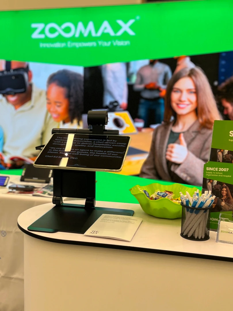 zoomax team demoing low vision magnifiers at sightcity frankfurt booth 1