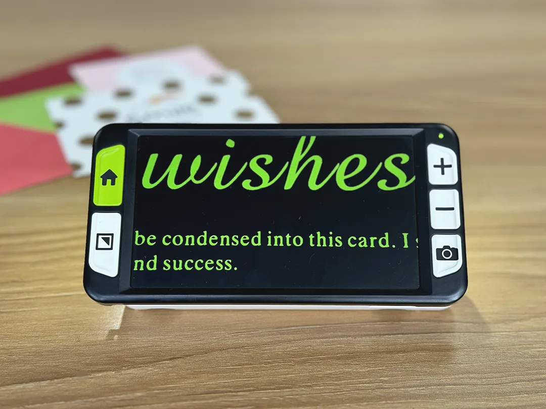 zoomax luna 6 handheld electronic video magnifier for low vision, showing slim portable design and built in reading stand