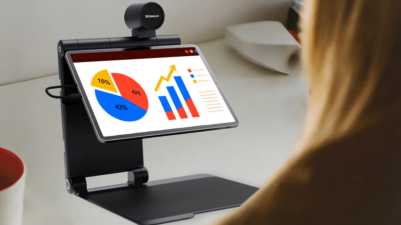 professional using zoomax snow pad portable low vision aid to review documents at a desk
