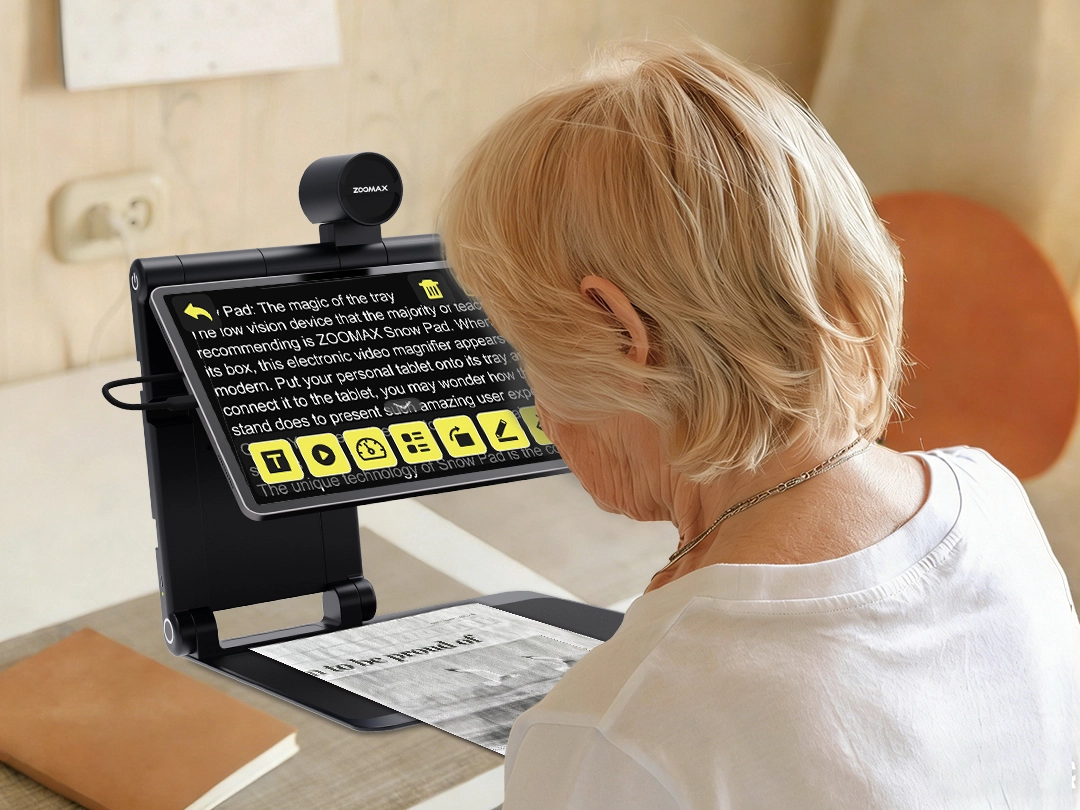 senior person using snow pad tablet magnifier for reading newspaper with ai text recognition