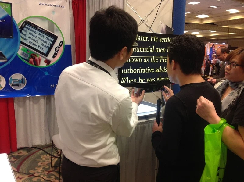 people test zoomax desktop video magnifier at exhibition csun 2013