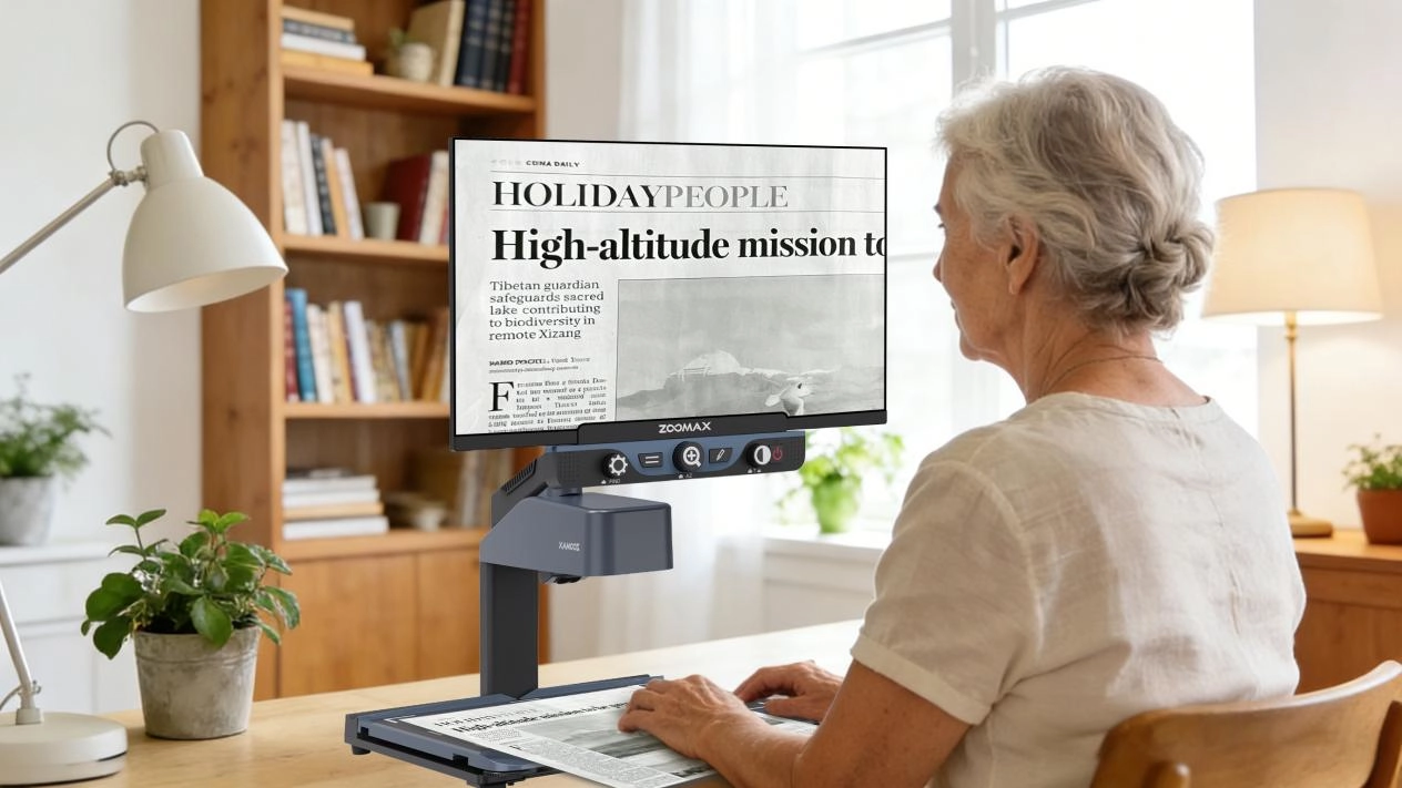 senior using a high definition electronic magnifier for reading with low vision
