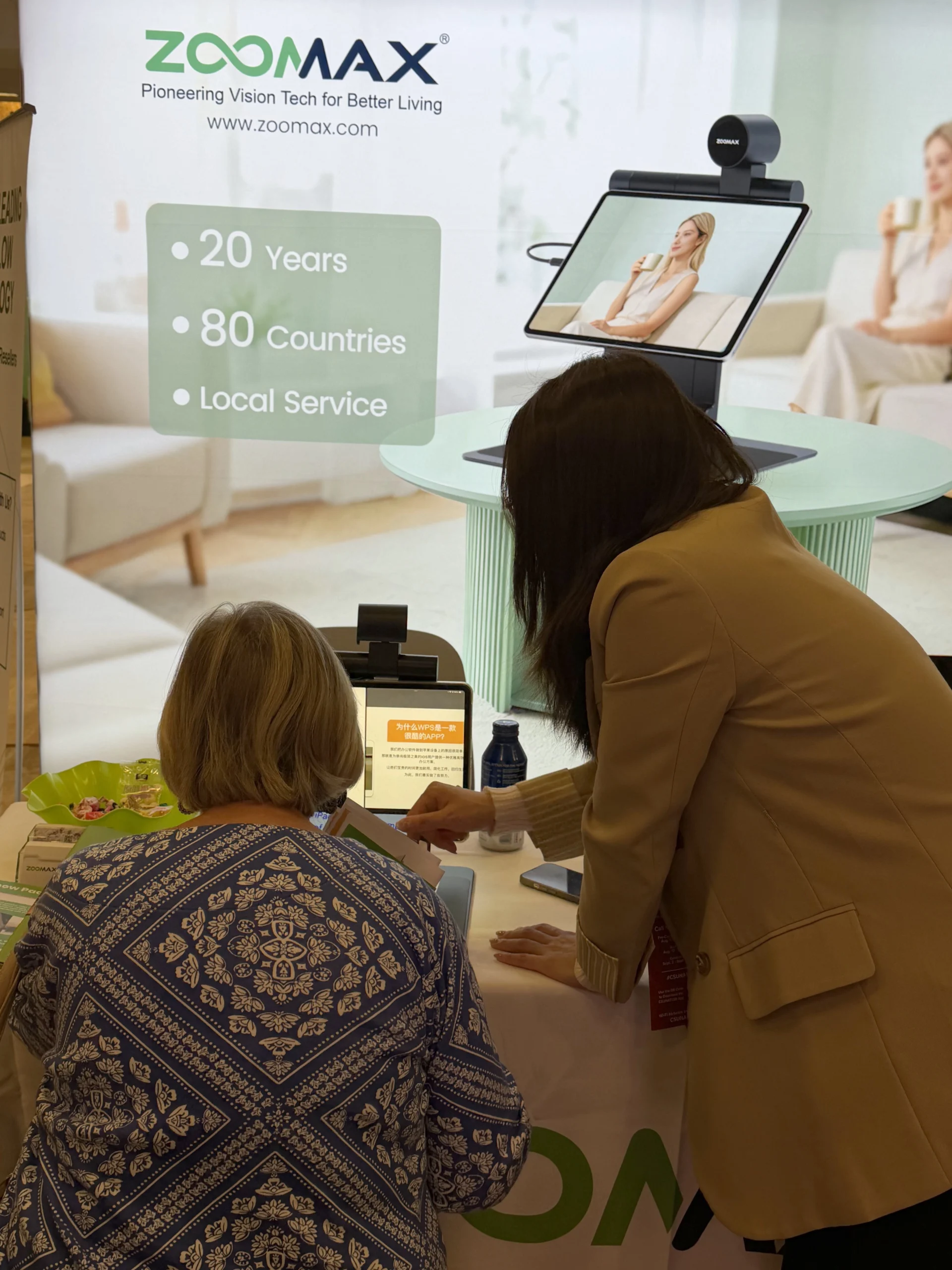 a visitor trying out the snow pad portable video magnifier