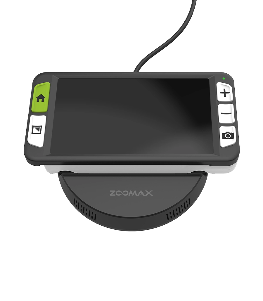 zoomax luna 6 digital magnifier on a wireless charging base for easy senior use