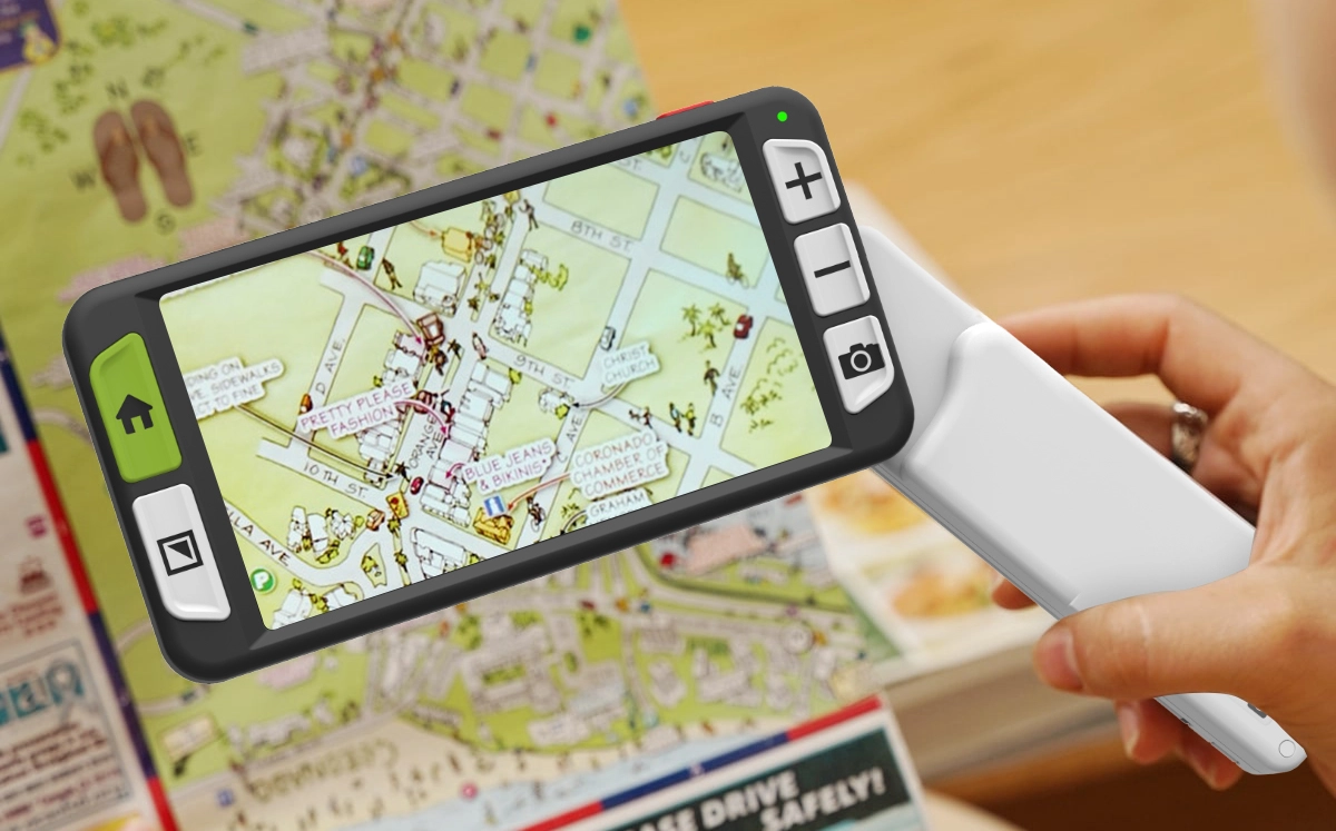 early stage dry amd user using luna 6 handheld electronic magnifier to read a map while traveling