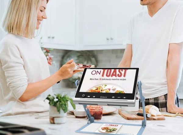 zoomax snow 12 low vision electronic magnifier used to read a recipe book in the kitchen all scene vision adaptability