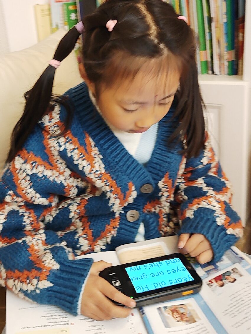 little girl using luna s for reading